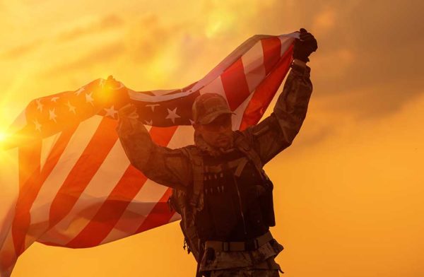 Soldier Celebrating Victory Armed Forces American Flag AdobeStock_Tomasz Zajda 111122294